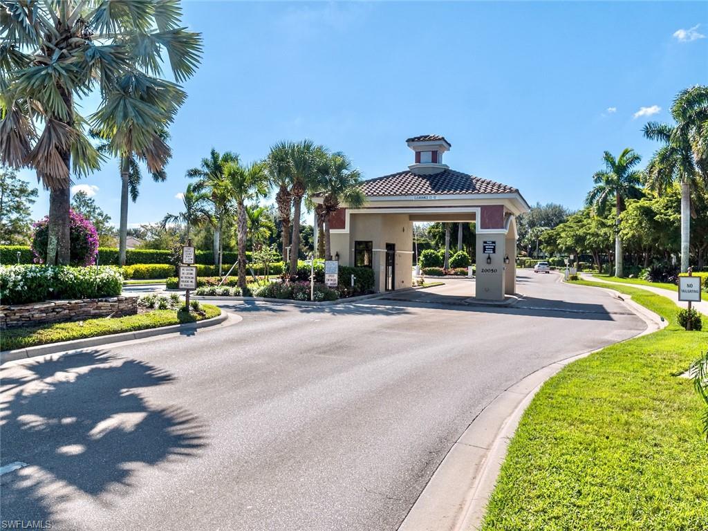 20026 Larino Loop Estero, FL 33928 - Photo 41 of 48 a front view of a house with a garden and plants