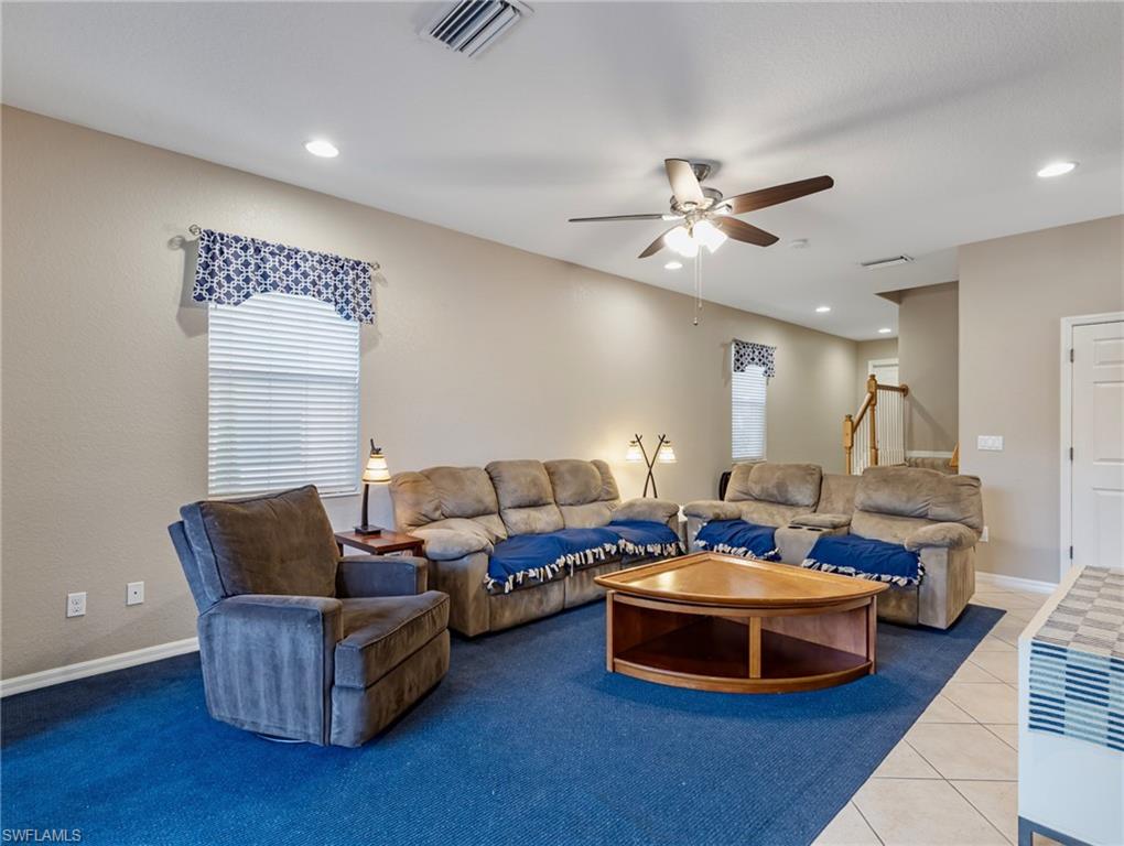 20026 Larino Loop Estero, FL 33928 - Photo 5 of 48 a living room with furniture and a ceiling fan