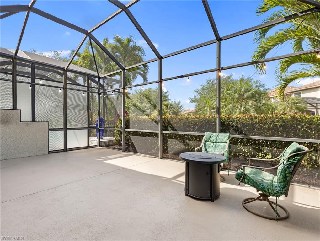 20026 Larino Loop Estero, FL 33928 - Photo 10 of 48 a view of a chairs and table in the patio