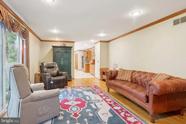 a view of a dining room with furniture and window