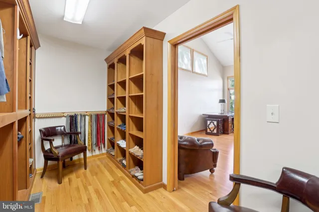 a spacious bedroom with a bed and a window