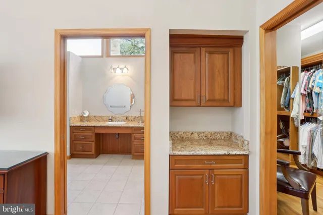 a view of house with yard and trees in the background