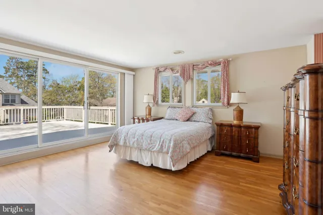 a bed room with a bed and a chandelier
