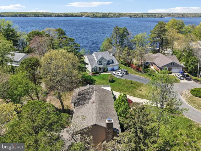 a view of a house with a yard and a garden
