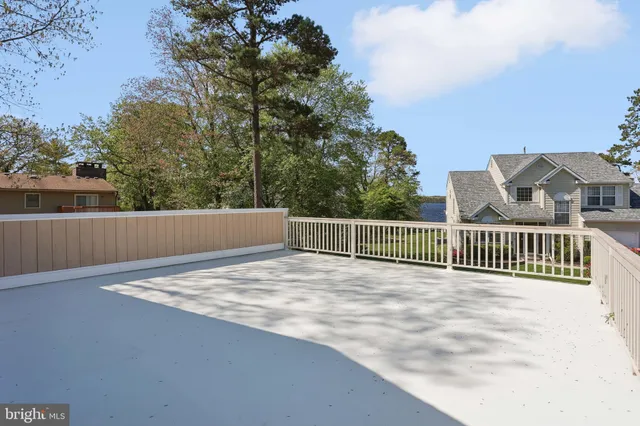 a view of a house with a yard and a garden