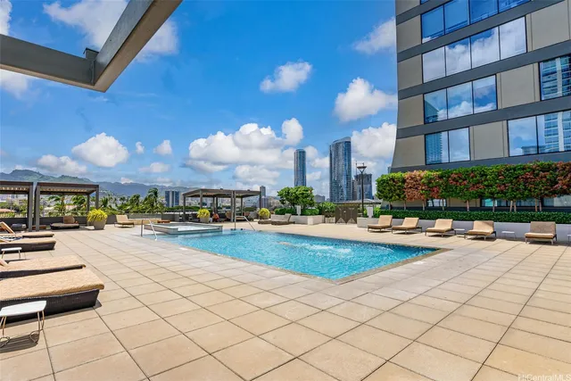 a view of a swimming pool and lounge chair