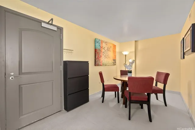 a view of a dining room with furniture and a window