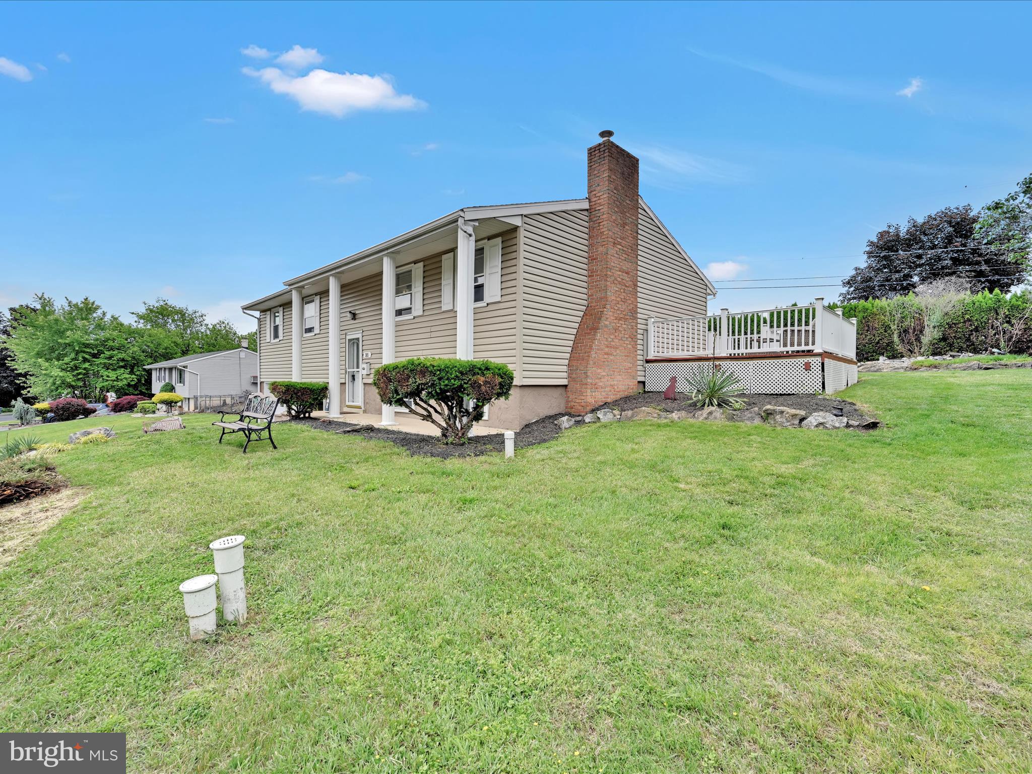 315 Morrison Road Reading, PA 19601 - Photo 2 of 30 a front view of a house with a garden and trees