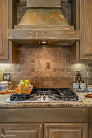 a stove top oven sitting inside of a kitchen