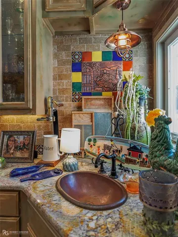 a room with fireplace and potted plant