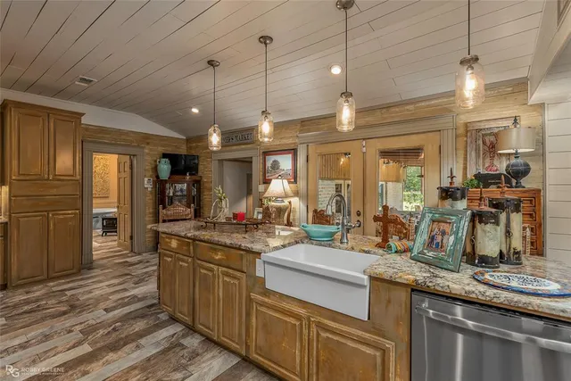 a kitchen with sink stove and refrigerator