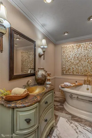 a bathroom with a granite countertop toilet a sink and a mirror