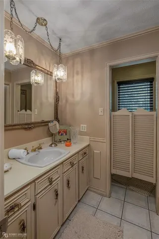 a bathroom with a sink a vanity and a mirror