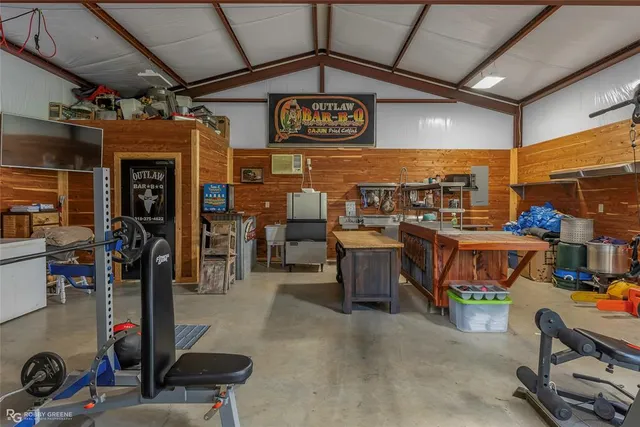 a view of a storage with a table and chairs
