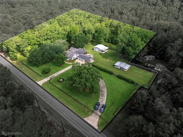 a view of a garden with an outdoor seating