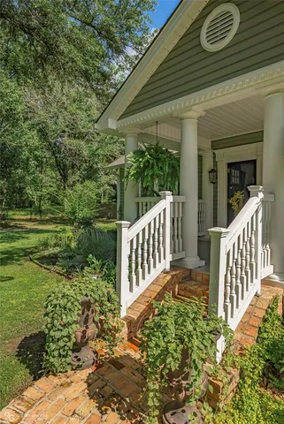 a view of a chair and table and chairs with wooden fence