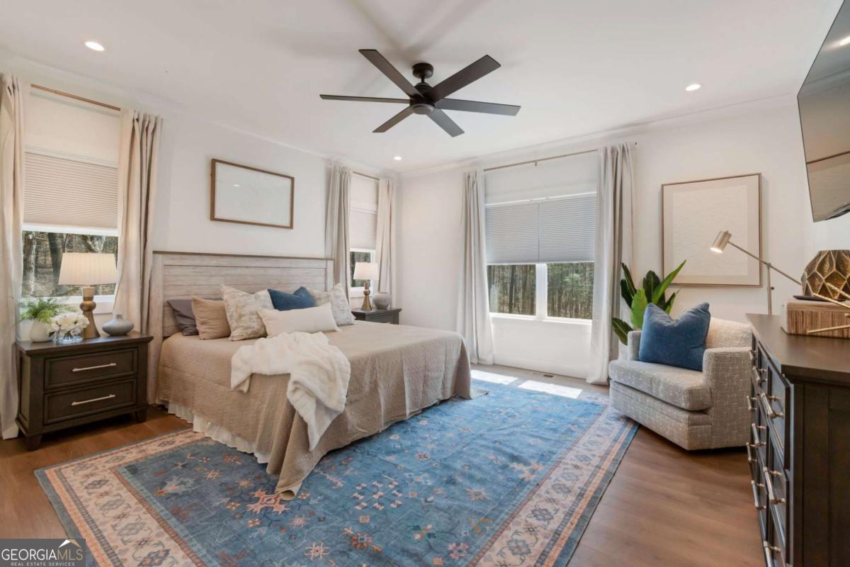 629 Butterworth Road Canton, GA 30114 - Photo 11 of 27 a bedroom with a large bed and a couch