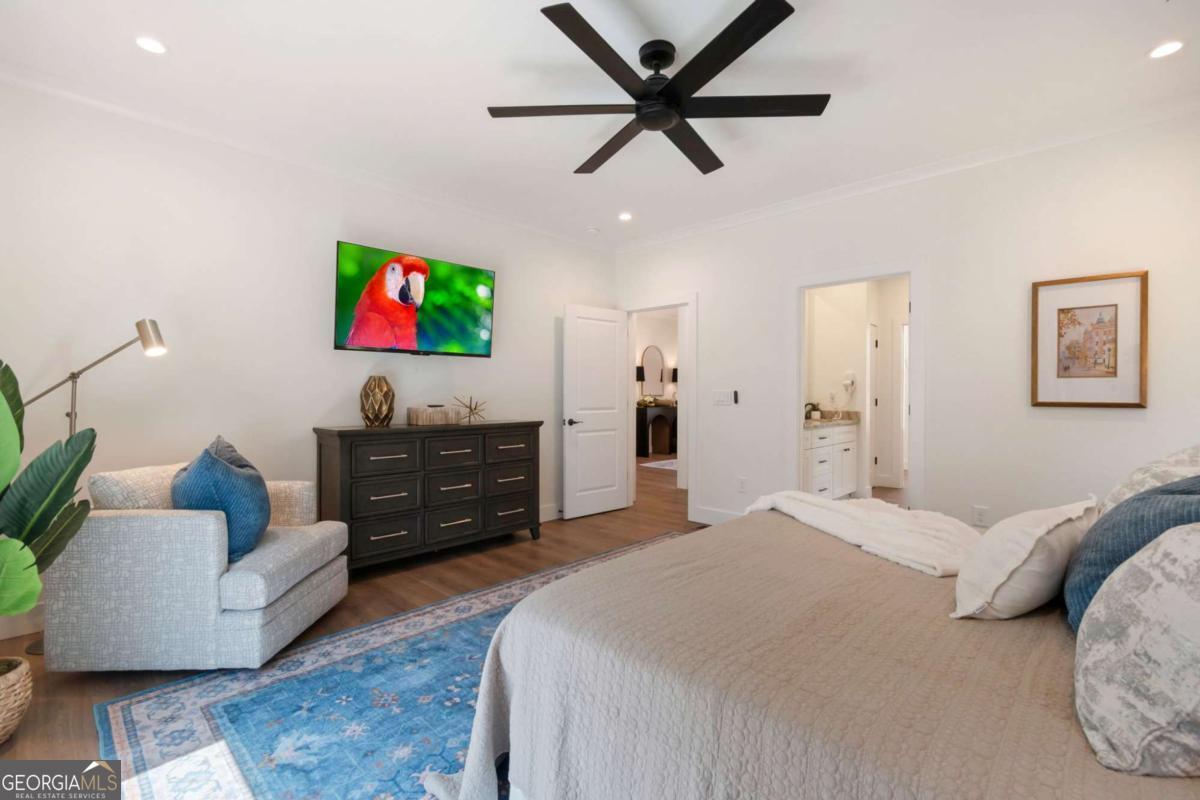 629 Butterworth Road Canton, GA 30114 - Photo 12 of 27 a bedroom with furniture and a flat screen tv