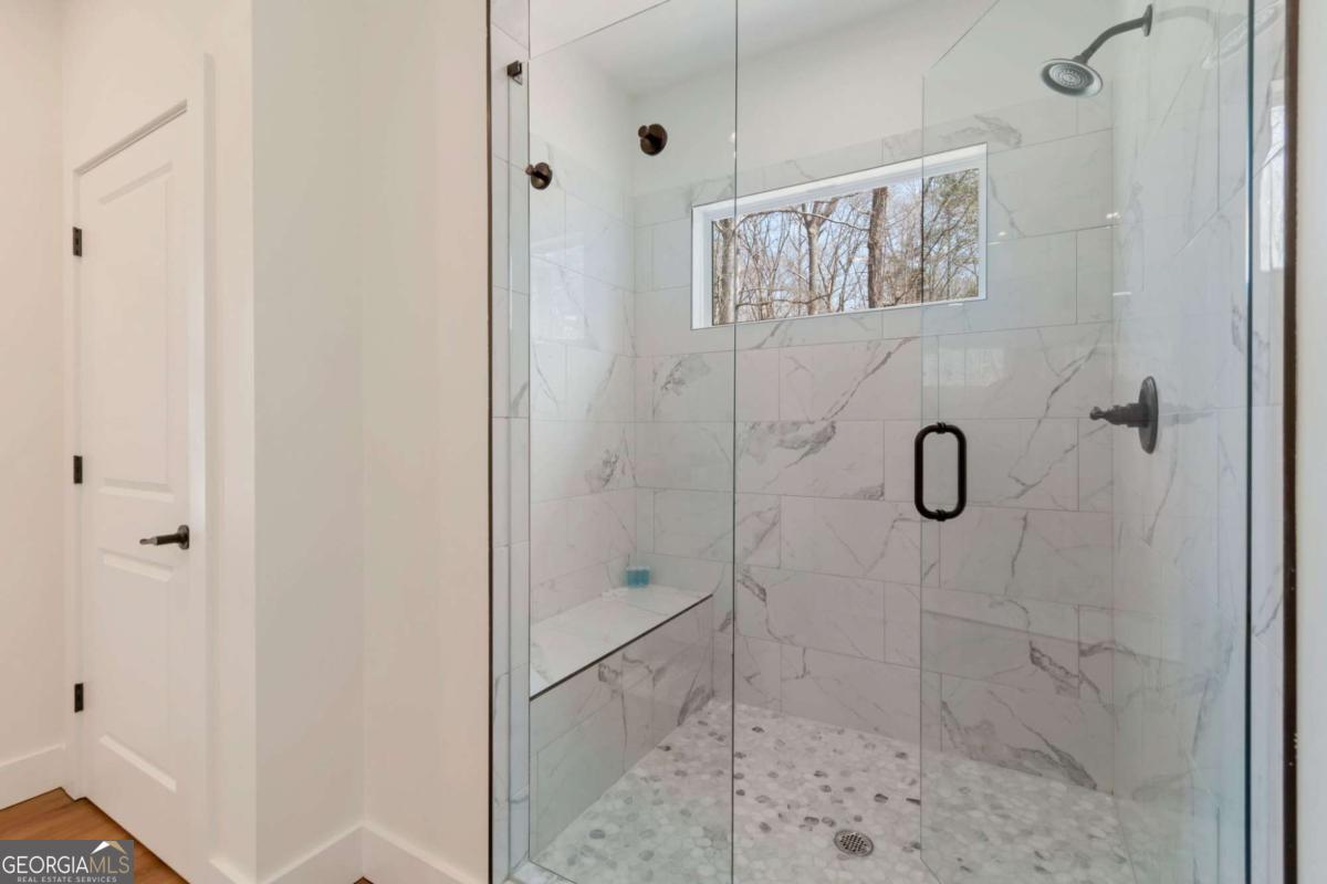 629 Butterworth Road Canton, GA 30114 - Photo 14 of 27 a bathroom with a shower