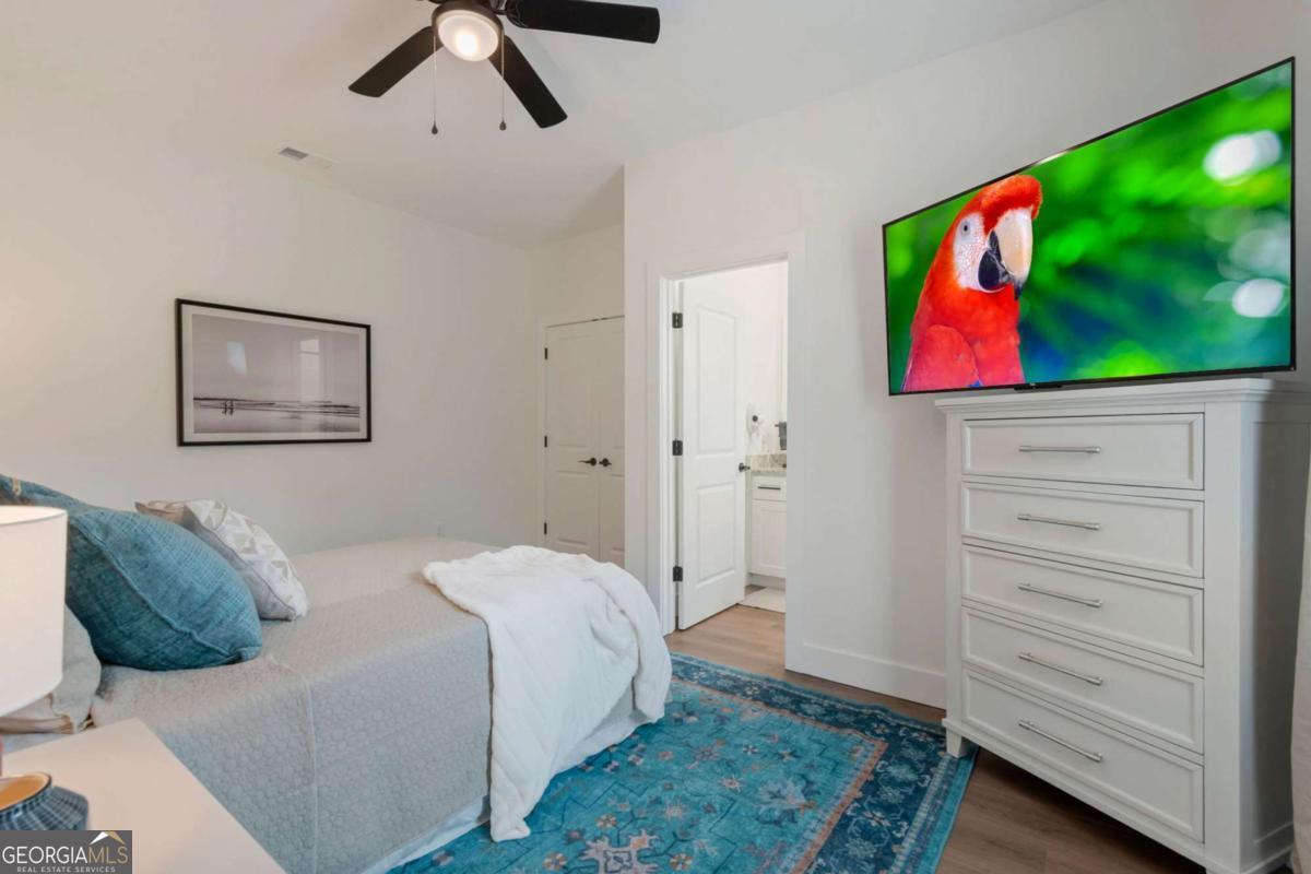 629 Butterworth Road Canton, GA 30114 - Photo 18 of 27 a bedroom with a bed and furniture