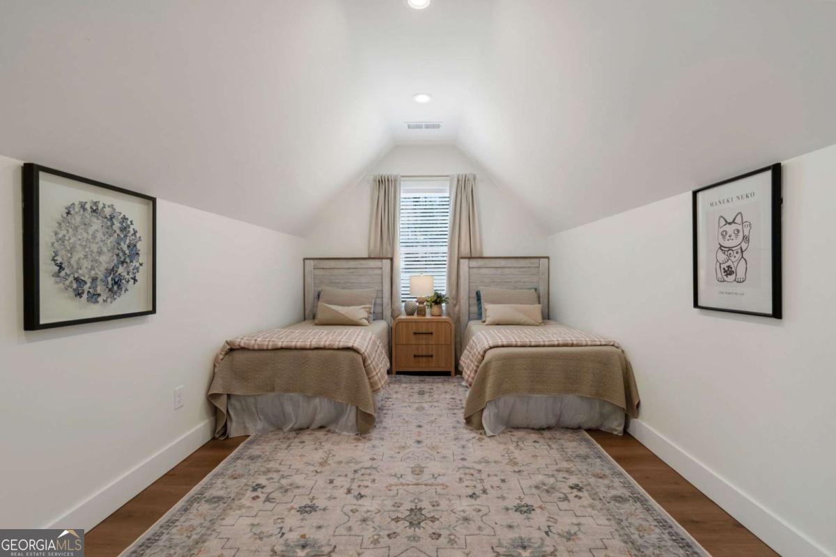 629 Butterworth Road Canton, GA 30114 - Photo 20 of 27 a bedroom with two large bed and two windows