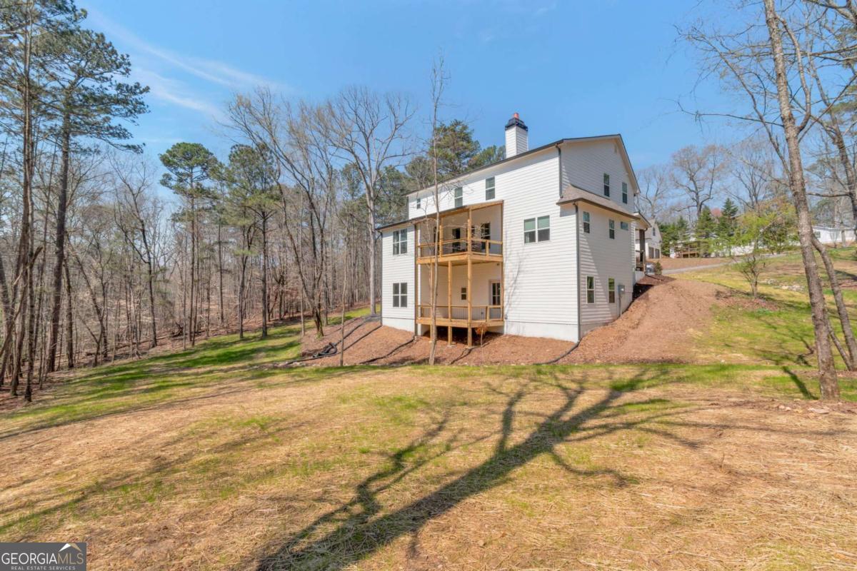 629 Butterworth Road Canton, GA 30114 - Photo 27 of 27 a view of a house with snow on the road