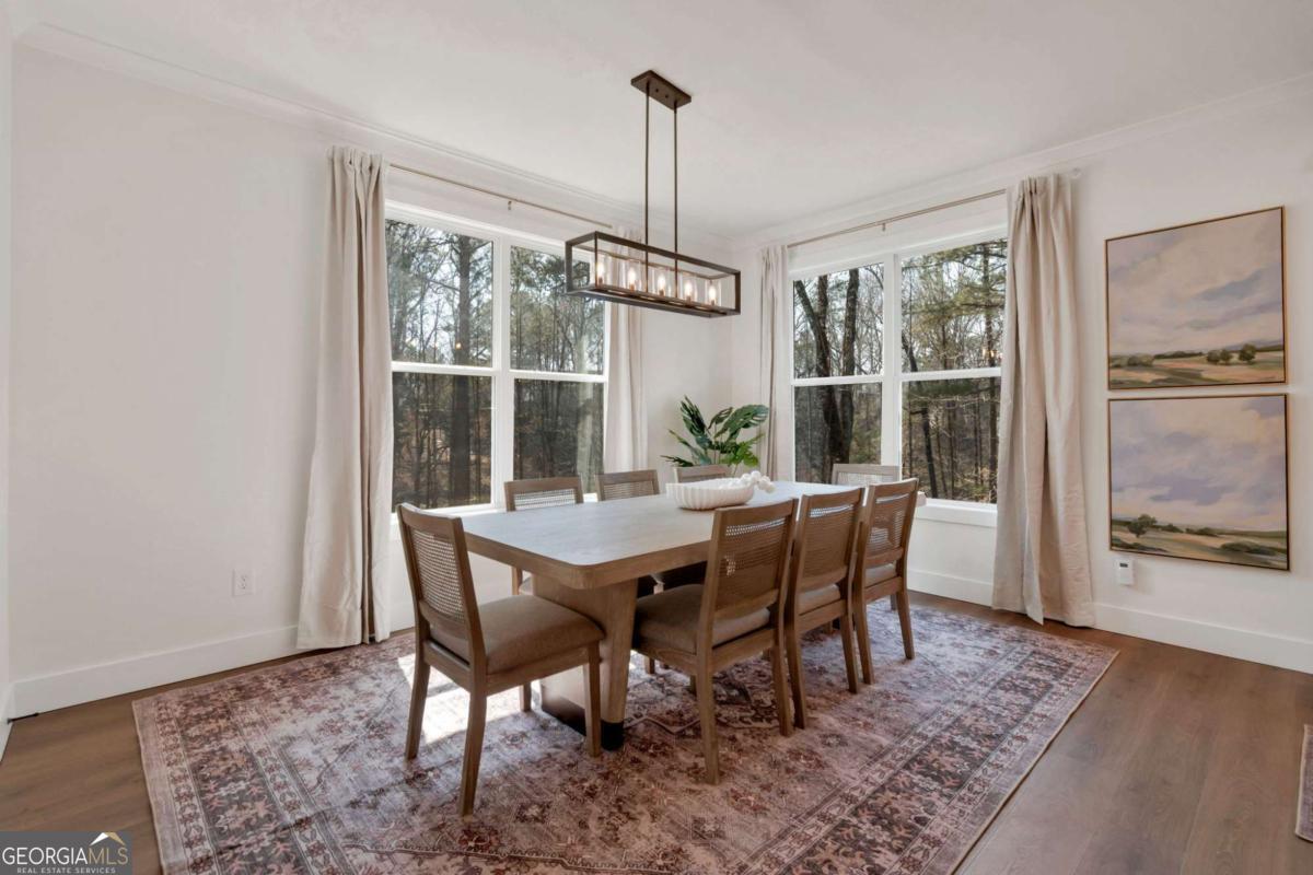 629 Butterworth Road Canton, GA 30114 - Photo 7 of 27 a dining room with furniture window wooden floor