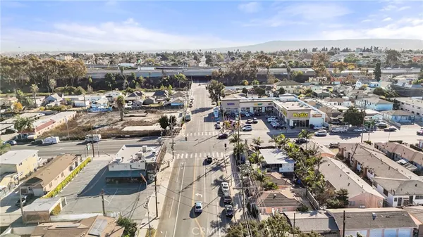 an aerial view of residential houses and car parked on street side