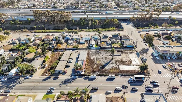 an aerial view of multiple houses with outdoor space
