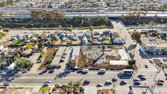 an aerial view of multiple houses with outdoor space
