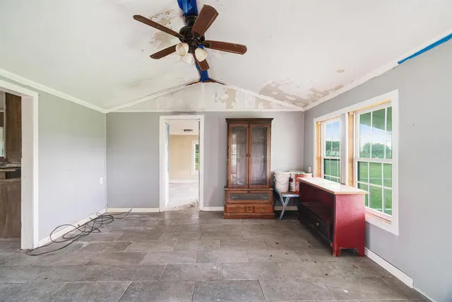 a bedroom with furniture and a window