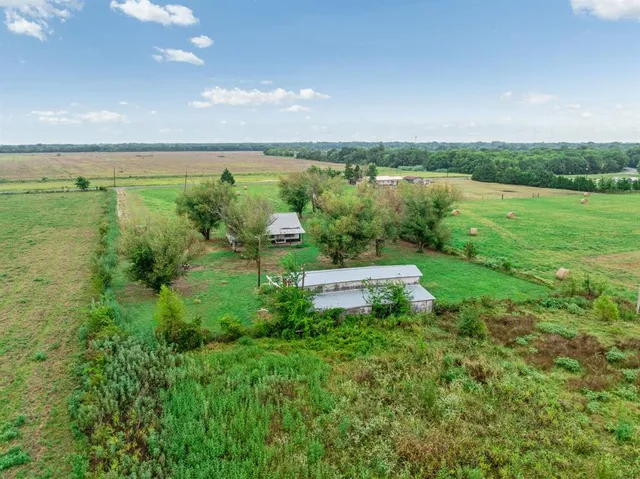 a view of a garden with an outdoor space
