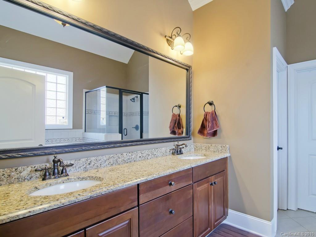 6729 Fox Ridge Circle Davidson, NC 28036 - Photo 11 of 24 a bathroom with a sink and a mirror