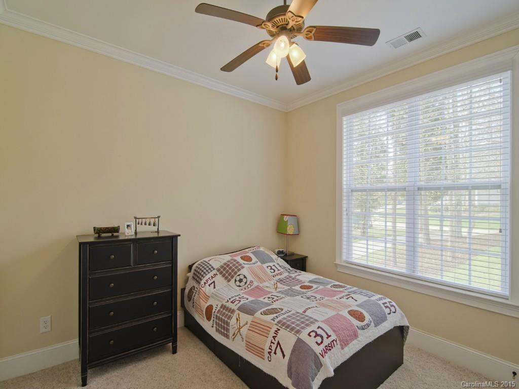 6729 Fox Ridge Circle Davidson, NC 28036 - Photo 13 of 24 a bedroom with a bed and a window