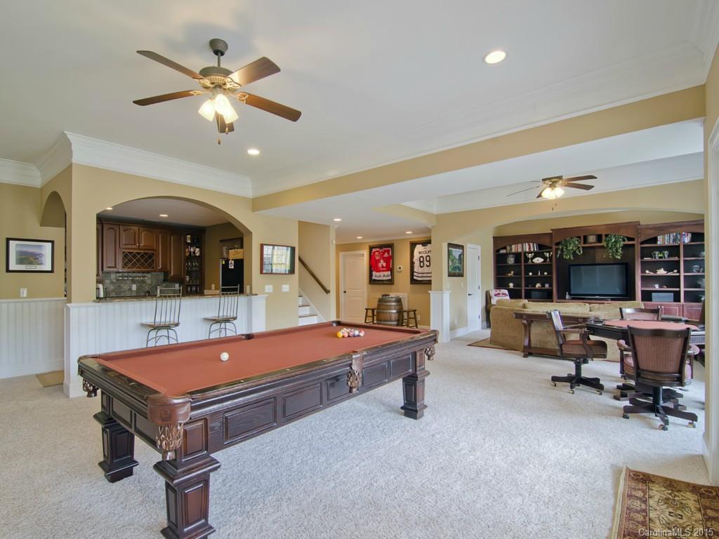 6729 Fox Ridge Circle Davidson, NC 28036 - Photo 17 of 24 a living room with furniture pool table and flat screen tv