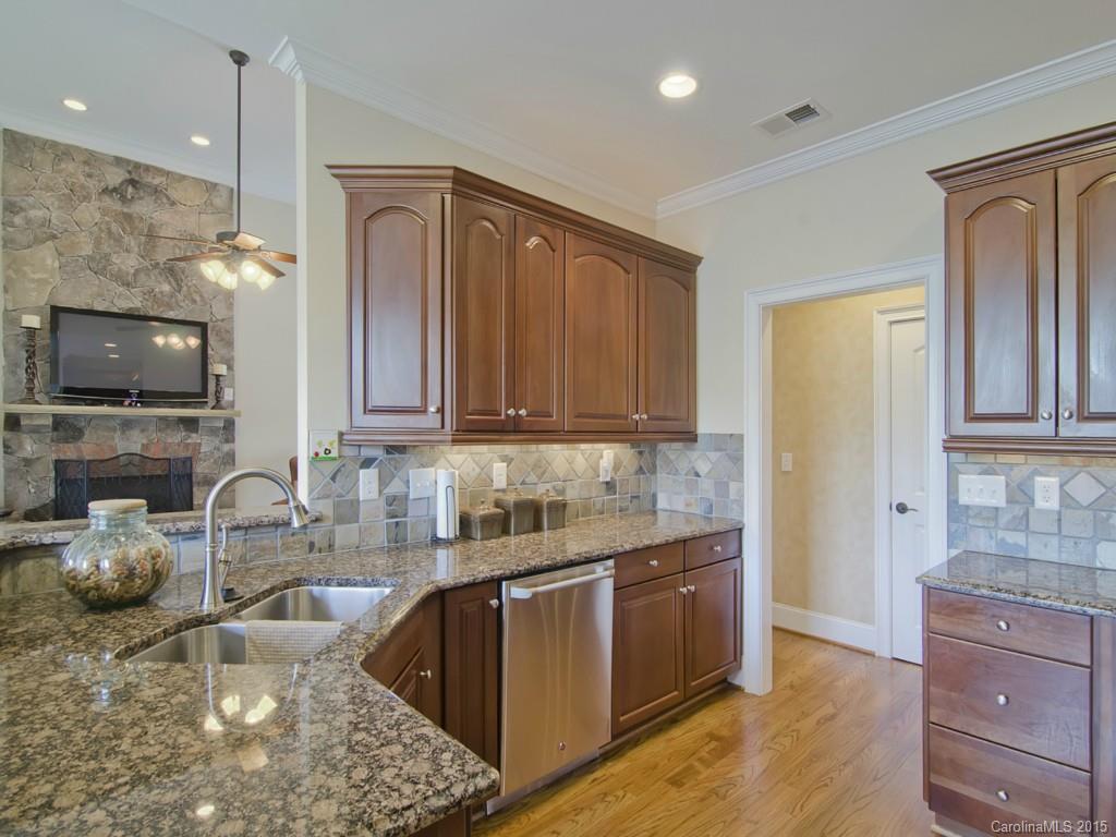 6729 Fox Ridge Circle Davidson, NC 28036 - Photo 4 of 24 a kitchen with sink a stove and cabinets