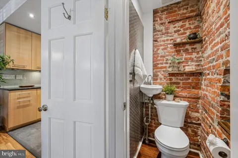 a bathroom with a toilet a sink and a shower