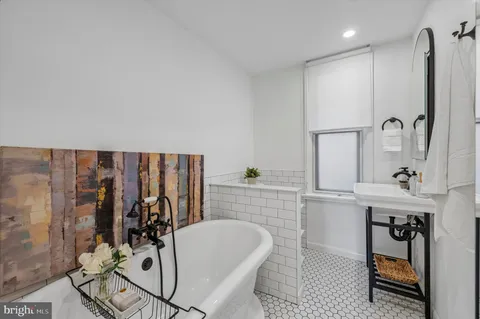 a bathroom with a sink and mirror