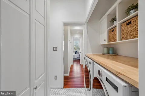 a view of a kitchen cabinets a wooden floor and a window
