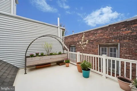 a view of outdoor space with garden and deck