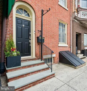 a front view of a building with parking space