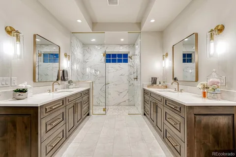 a spacious bathroom with a double vanity sink a mirror and a bathtub