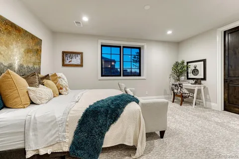 a bedroom with a bed and a table in it