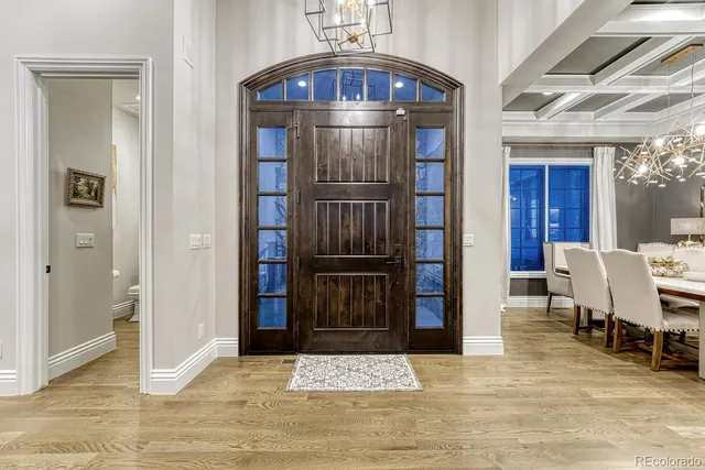 a view of a livingroom with furniture and an entryway