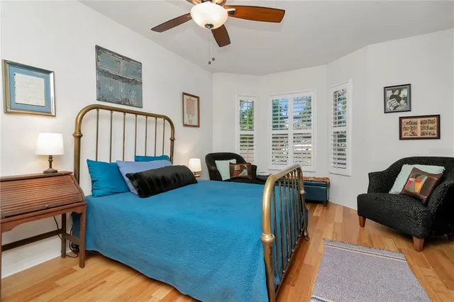 a bedroom with furniture and a window