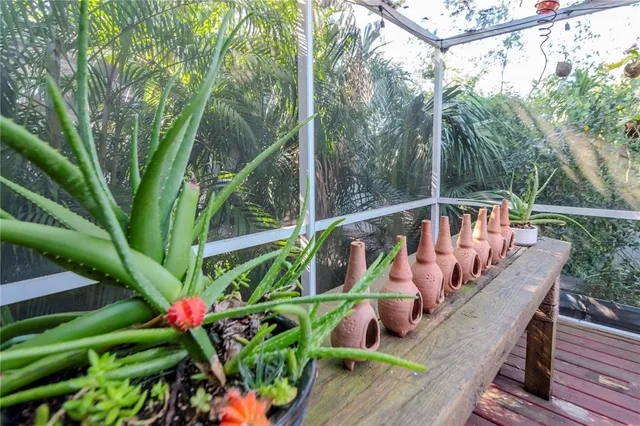 a view of a balcony with wooden floor