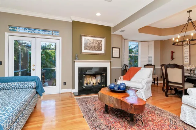 a living room with furniture fireplace and window