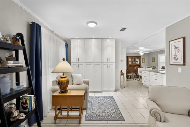 a living room with furniture and a rug