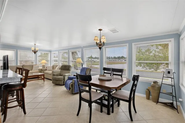 a view of a dining room with furniture window and outside view