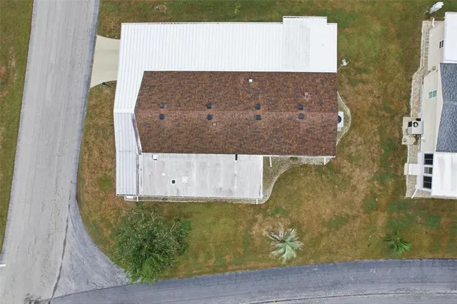 a front view of a house with a yard table and chairs